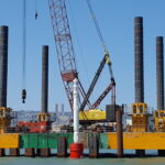 Combifloat C7 modular jack up barge with crane on IHC S280 piling hammer